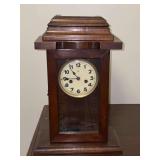 Vintage German Junghans pendulum wall clock featuring a wooden case with glass paneling and key…..not tested…..11-1/2 x 6-1/4 x 17-1/2 tall