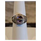 10k white gold class ring size 6 w/light purple stone surrounded by clear stones...1 missing(NOT DIAMONDS) 7.8 total grams...