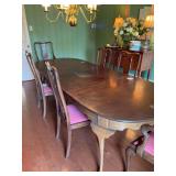 Antique dining room table with 6 chairs.  The table measures 101“ x 42“ x 30“ with three leaves. Each leaf is 12 inches wide.  The chairs are 23” x 19” x 43”. The seat height is 19 inches 
