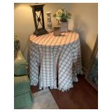 30 by 30 by 30” round three leg wooden table with nice yellow, red and green table skirt