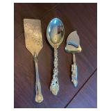 3 serving pieces; Vintage Godinger grape 10 1/2 inch serving spoon, Arthur Court 8 1/2 inch bunny, cheese slicer, and a 11 1/2 inch silver plate lasagna server