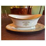Lenox gold rimmed 10 inch gravy boat.  China pattern is Castle Garden. ￼