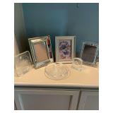 Group of frames and decor pieces; the sand dollar bowl is 6 1/2 inches round, the  Concept quartz clock is 3” x 3”￼