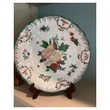 10 1/2 inch decorative plate with wall hanger.