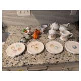 Grouping of pier 1 plates, cream and sugar bowls and salt and pepper shakers