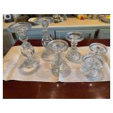 Set of six heavy glass candle holders 10 inches tall, 6 1/2 inches tall and 3 inches tall they are all 4 1/2 inches wide