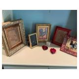 Group of home decor pieces, including three frames