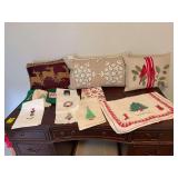 Three Christmas pillows with assortment of hand towels