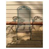 Green stationary wrought iron patio chair