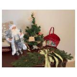 33 inch Christmas swag, 18 inch Santa Claus a red snowman basket that is 13” x 14” and a 24 inch Christmas tree with fishing ornaments