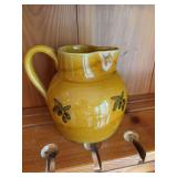 Gold pottery pitcher.