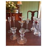 Four sets of glass candle holders.
