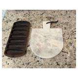 A marble cutting board and a cast-iron corn muffin skillet