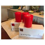 Two boxes of three for a total of six red 3” x 4” candles