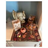 Fall table runner with a 8 x 10 1/2” resin turkey, three boxes of fall table scatter and a few Halloween pieces