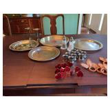 Four international silver plate trays, salt and pepper shaker, and three sets of napkin rings and a pair of candle holders