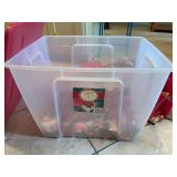 An ornament organizer full of vintage ornaments and gold bows