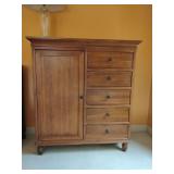 Solid Wood Chifferobe. Door compartment has removable shelves and can be converted to hanging clothes, 5 drawers. 49 1/2" T x 45" W x 21" D, really nice medium finish with dark bronze hardware. May be