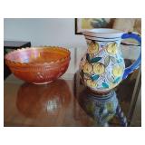 Vintage marigold carnival glass bowl featuring the "Stork and Rushes" pattern. And, traditional Italian majolica featuring a yellow lemon and green leaf motif with a cobalt blue handle, rim and bottom