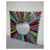 Pier One Sunburst wall mirror with a vibrant, multi-colored mosaic frame made of glass. 31 1/2" x 31 1/2".
