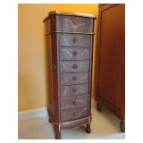 Vintage-style jewelry armoire, Ox Blood Red with gold feather/bird/floral Motif and trim. 39 1/2" T x 15" W x 15" D. Top compartment opens/mirrored, ring drawer, 7 drawers, side compartments for neckl