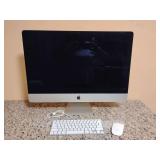 Apple iMac all-in-one desktop computer, aluminum stand and a large display, with new unused Apple Magic Keyboard and Magic Mouse and one used keyboard.