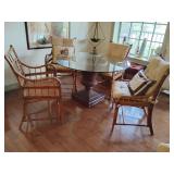 Great Casual Dining Set, Unique mix, Milling Road vintage bamboo and rattan chairs, rattan urn table base dark brown with glass top. 3 chairs have arms, 1 does not, have Pottery Barn grass tie cushion