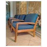 Set of 2 Christopher Knight Home Grenada Outdoor Acacia Wood Club Chairs, featuring a teak finish frame and water-resistant teal or blue cushions.