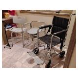 Black quad walking cane featuring an offset handle and a four-point base for added stability. Shower chair with a backrest. Portable 3-in-1 bedside commode chair. Manual transport wheelchair with a ch