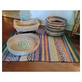 Quilted fabric rag basket, round rattan serving tray featuring a blue and white mother of pearl inlay pattern, wicker bassinet type, Yumi Blue Multi-Color Rag Area Rug 24" x 38".