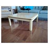 Vintage coffee table, featuring lacquered goatskin, or faux goatskin, in an off-white color. Has 4 blemishes on top see pics. 15 3/4" T x 38" x 38".