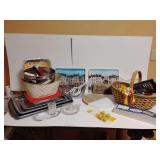 Kitchen utensils, nice woven basket, 2 Wilton cookie sheets, 2 decorative plastic trays. See pics. Only items on this table.