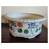 Vintage AAA Imports footed planter featuring a raised floral design and a scalloped edge. 5 1/4" T x 12 1/4" across.
