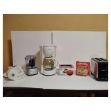 Small Appliances: Krups electric can opener, Cuisinart small food processor, Signature Gourmet 12 cup coffee maker, Dash go mini waffle maker, Egglettes, Hamilton Beach 2 slice toaster. All untested.