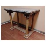 Antique-style console table featuring carved column supports and a stone top. 36 1/2" T x 44" W x 28" D.