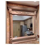 Antique French-style wall mirror featuring an ornate, carved oak frame. 38 1/2" L x 36" W.