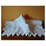 Linen Grouping: white matelassé tablecloth apprx. 52" x 52" has stains, small pillow case has stains 12" x 16",  4 tissue box covers?, table cloth 72" x 108", crocheted pillow case standard, round bo