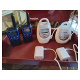 VTech DM221 Safe&Sound Digital Audio Baby Monitor set, which includes a baby unit, parent unit(s), and power adapters. And, a pair of Midland XT60 two-way radios.