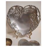 Selection: Arthur Court Grape Heart Coupe Tray, bronze tone charger, ceramic gold dish, vintage heart-shaped candy trinket dish, ornate floral scroll patterns, Pier 1 Imports cork bottom silver metal 