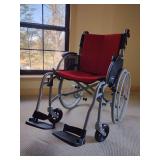 FeatherMobility Gray Lightweight Folding Wheelchair, known for being extremely lightweight.
Weight: Weighs approximately 13.5 lbs without wheels and 19 lbs with wheels and leg rests. 
Capacity: Suppor