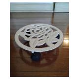 Cast iron plant caddy or plant stand with wheels, 2 3/4" T x 11 1/2" across.