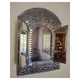 Vintage Mexican punched tin trifold mirror, handcrafted design with turtle doors. 11 1/2" x 8 1/2" hangs on the wall.
