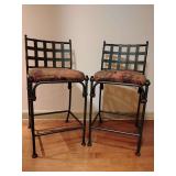 Pair Black Metal Bar Stools, cushion seat, back height 36 1/2", seat height 26 1/2", 18 1/2" W, 23" D, back legs curve back. Cushions purple pink green tapestry.