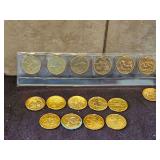 Commemorative collection of Sixteen(16) Uncirculated U.S. State Quarters(2001, 2002, 2004, 2006) layered in 24K gold SEE ALL PICS FOR DETAILS...