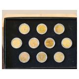 Commemorative collection of Ten(10) Uncirculated U.S. State Quarters(1999-2000) layered in 24K gold in protective capsules & in Original box SEE ALL PICS FOR DETAILS...