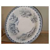 Blue transferware wash bowl with swans. Approximately 14.5 in diameter.