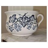 Vintage antique chamber pot with blue transfer wear pattern.