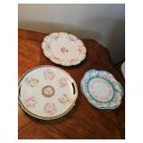 Three lovely vintage/antique decorative plates. Top is Limoges France, bottom two are from Bavaria. Also includes gravy boat with under plate. Reinhold Schlegelmilch hand painted. (Chipped plate)