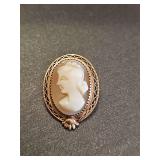 Cold tone cameo pendant. Unmarked. Non-reactive to magnet.