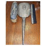 Sterling silver mirror, shoe brush, comb. Comb is not original to the set.